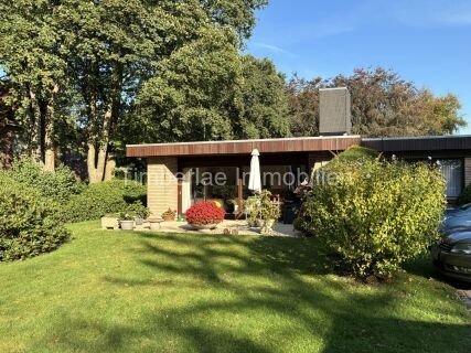 Charmanter Flachdachbungalow mit 2 Ferienwohnungen – Traumhafte Gartenanlage nahe dem Timmeler Meer Charmanter Flachdachbungalow mit 2 Ferienwohnungen – Traumhafte Gartenanlage nahe dem Timmeler Meer